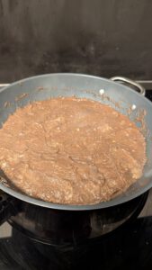 Wet mushroom mixture cooking in a pan