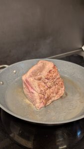 Seared beef fillet browned all around in a pan